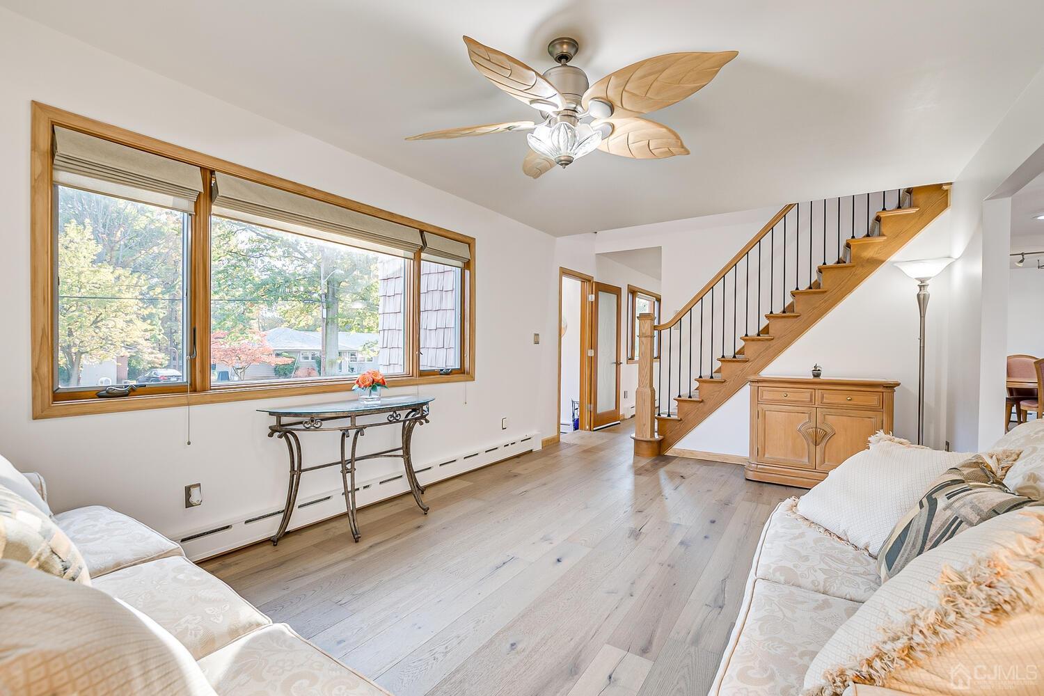 37 Utica Road Edison, NJ 08820 - Photo 10 of 53 a view of a bedroom with wooden floor and stairs