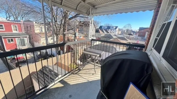 a view of a balcony with furniture