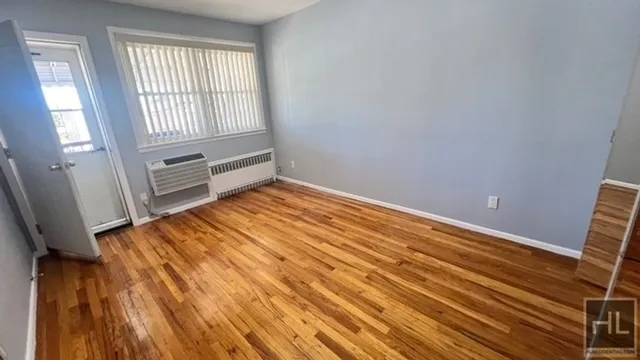 a view of an empty room and a window