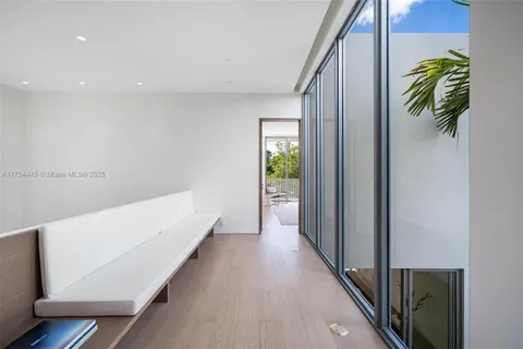 a spacious bedroom with a bed and a large window