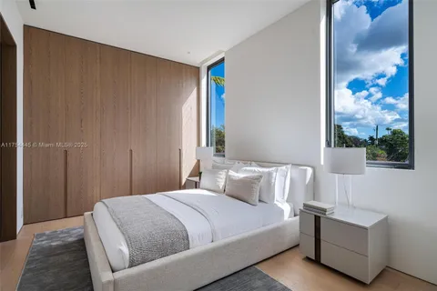 a view of a backyard with plants and a patio