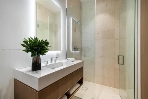 a view of a backyard with plants and a patio