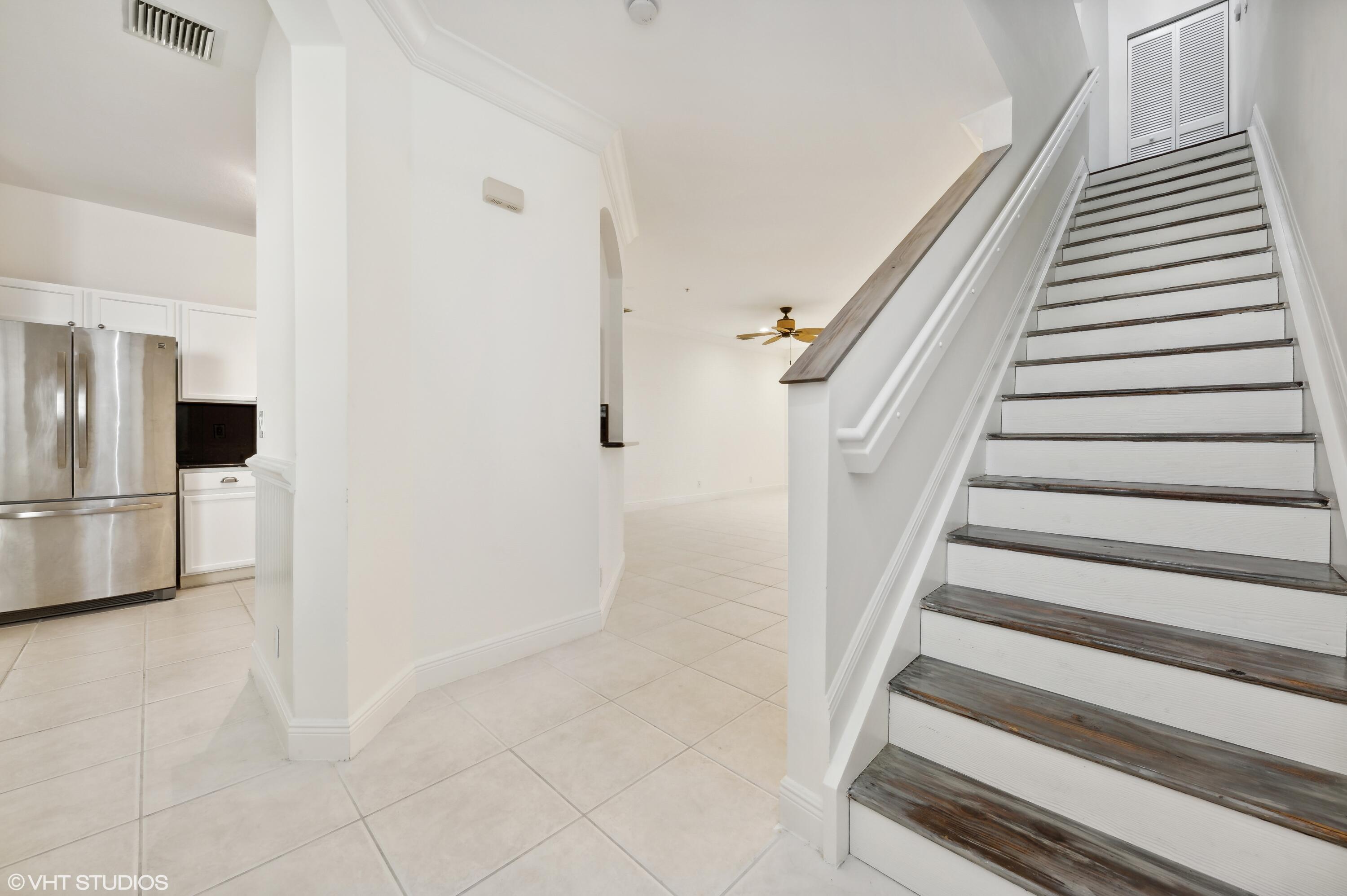 103 Lighthouse Circle, Unit D Tequesta, FL 33469 - Photo 3 of 36 a view of staircase with white walls