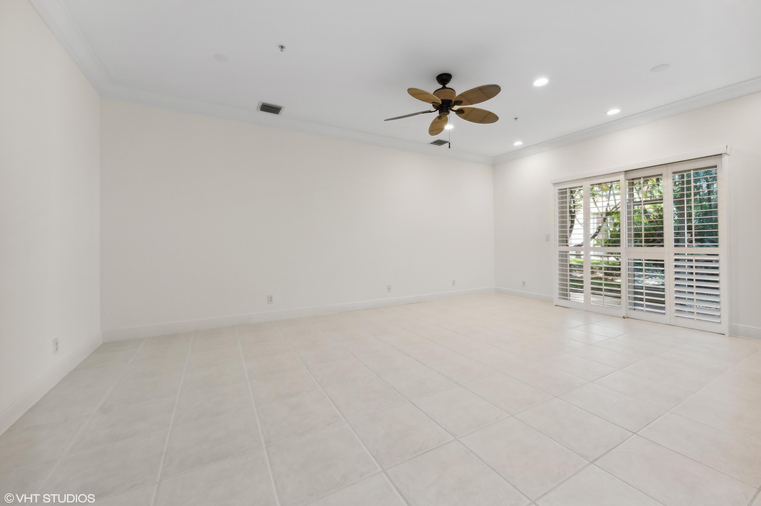 103 Lighthouse Circle, Unit D Tequesta, FL 33469 - Photo 5 of 36 a view of a livingroom with a ceiling fan and window