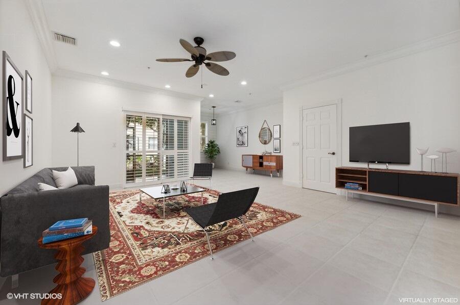 103 Lighthouse Circle, Unit D Tequesta, FL 33469 - Photo 7 of 36 a living room with furniture and a flat screen tv