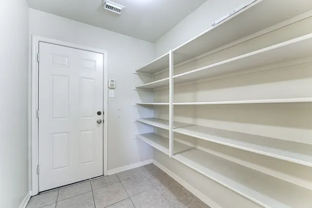 a view of an empty walk in closet