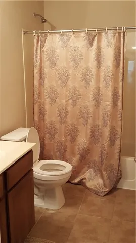 a room with a cabinets and a window