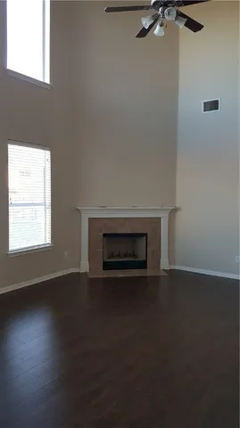 an empty room with a fireplace
