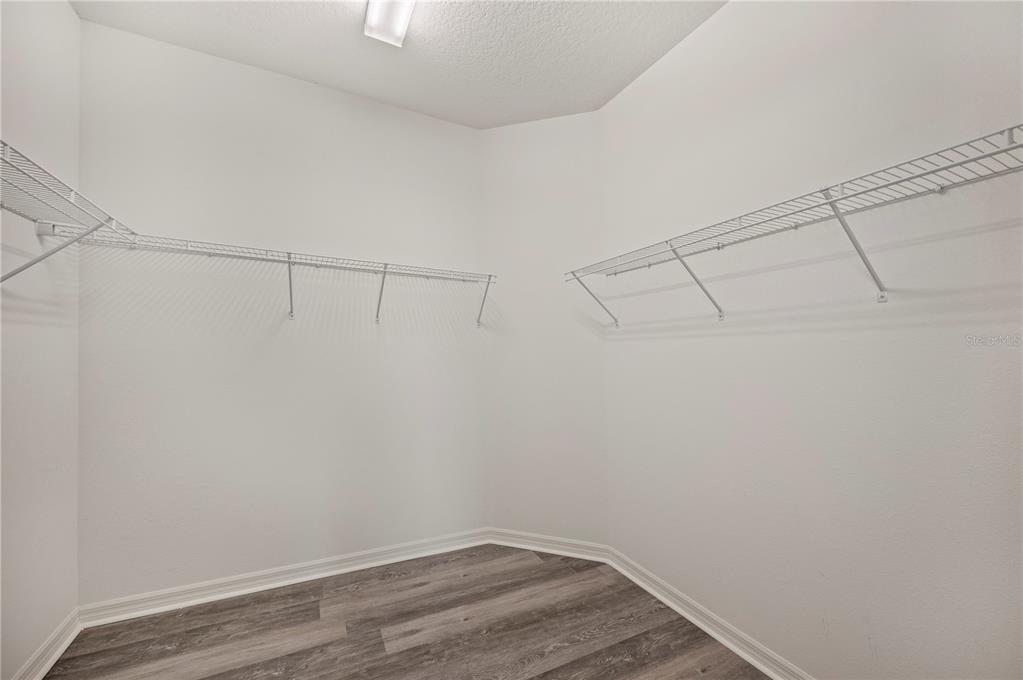 4303 Moon Shadow Loop Mulberry, FL 33860 - Photo 13 of 30 a view of a room with racks on the wall