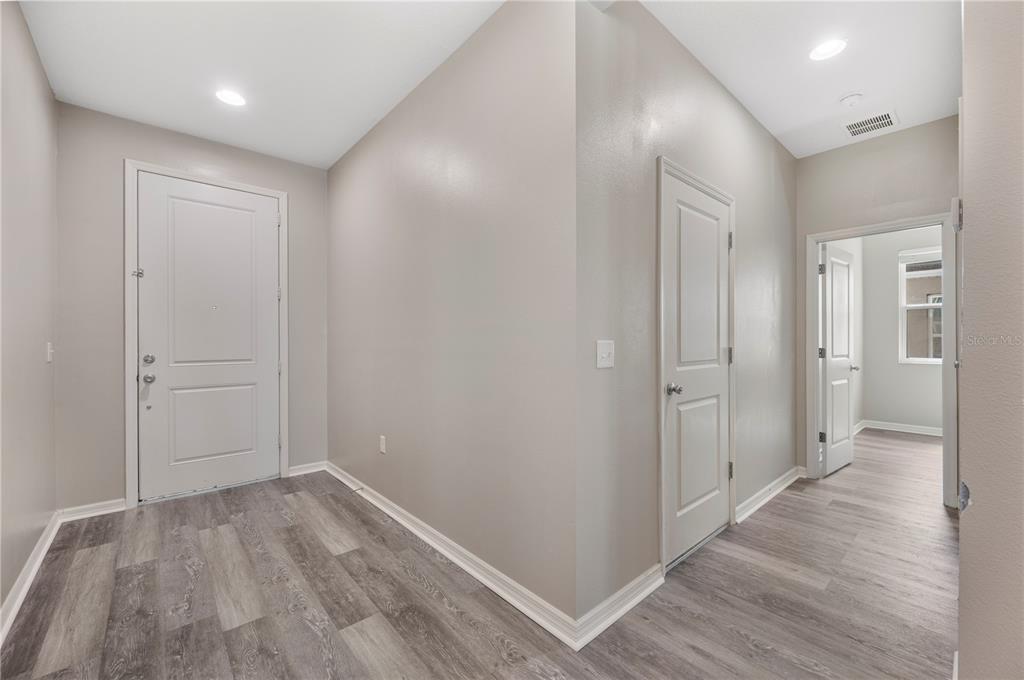 4303 Moon Shadow Loop Mulberry, FL 33860 - Photo 23 of 30 wooden floor in an empty room with wooden floor