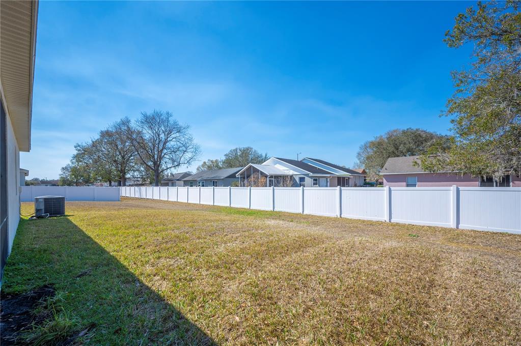 4303 Moon Shadow Loop Mulberry, FL 33860 - Photo 27 of 30 a view of a back yard