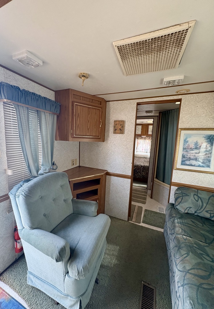 5-498 Woodhaven Sublette, IL 61367 - Photo 12 of 22 a living room with furniture and a window