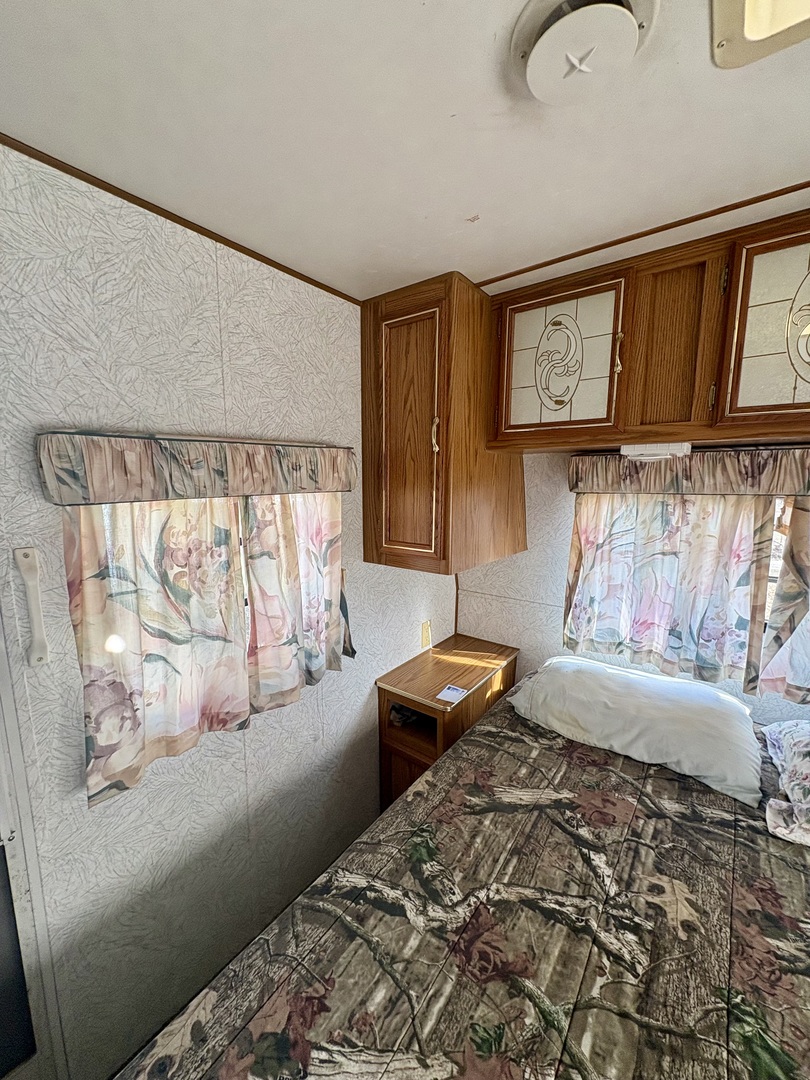 5-498 Woodhaven Sublette, IL 61367 - Photo 14 of 22 a bedroom with a bed and window