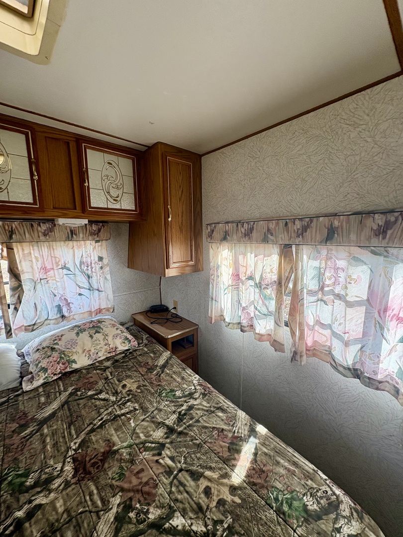 5-498 Woodhaven Sublette, IL 61367 - Photo 15 of 22 a bedroom with a bed and a window