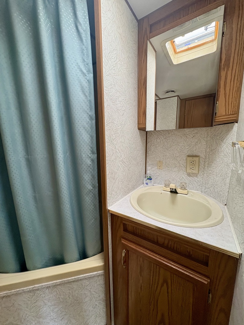 5-498 Woodhaven Sublette, IL 61367 - Photo 16 of 22 a bathroom with a sink and a mirror