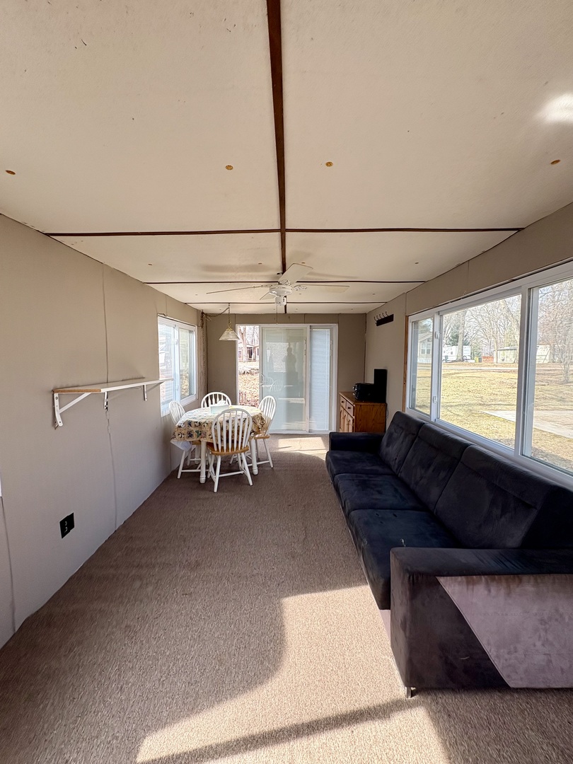 5-498 Woodhaven Sublette, IL 61367 - Photo 19 of 22 a living room with furniture and a large window