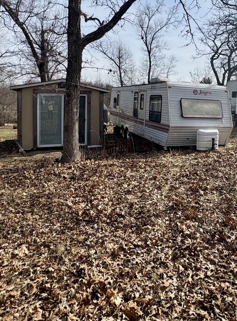 5-498 Woodhaven Sublette, IL 61367 - Photo 2 of 22 a backyard of a house with lots of green space