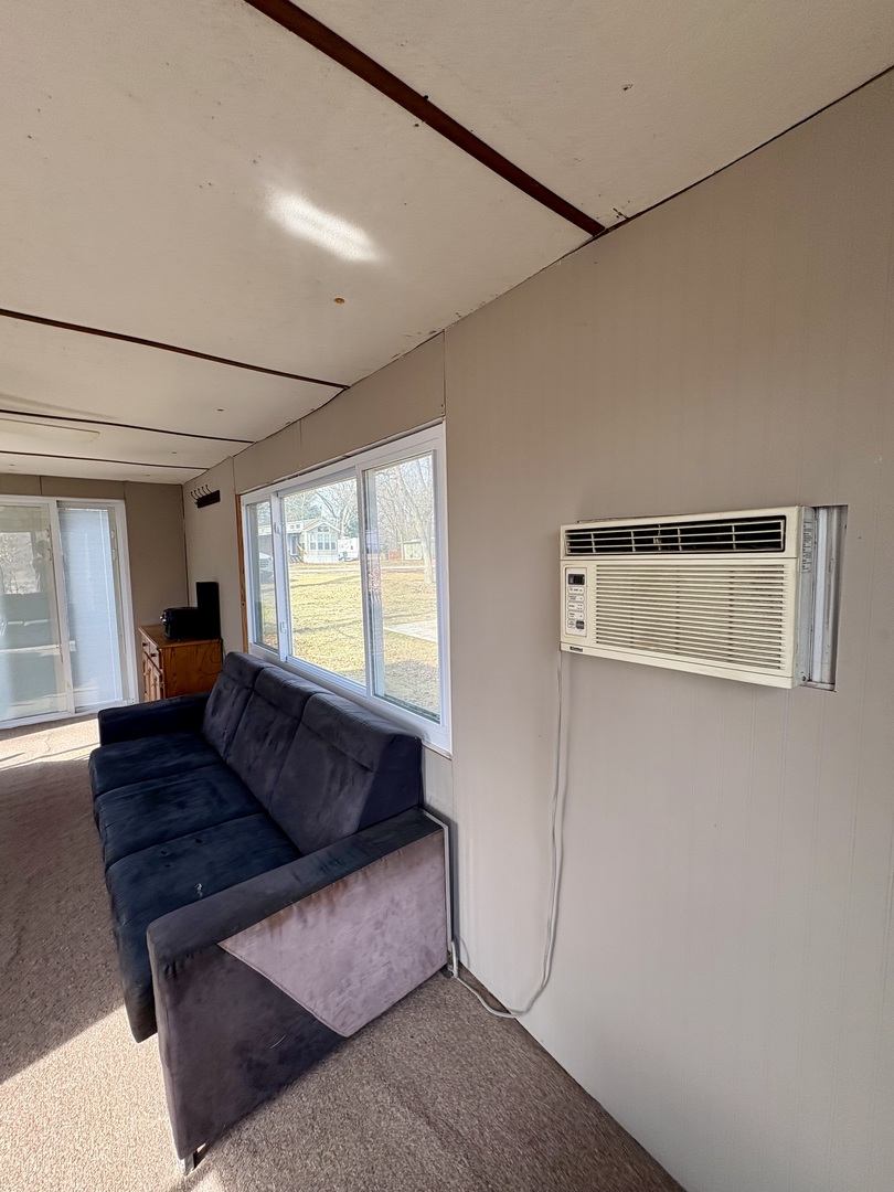 5-498 Woodhaven Sublette, IL 61367 - Photo 22 of 22 a living room with furniture and a window