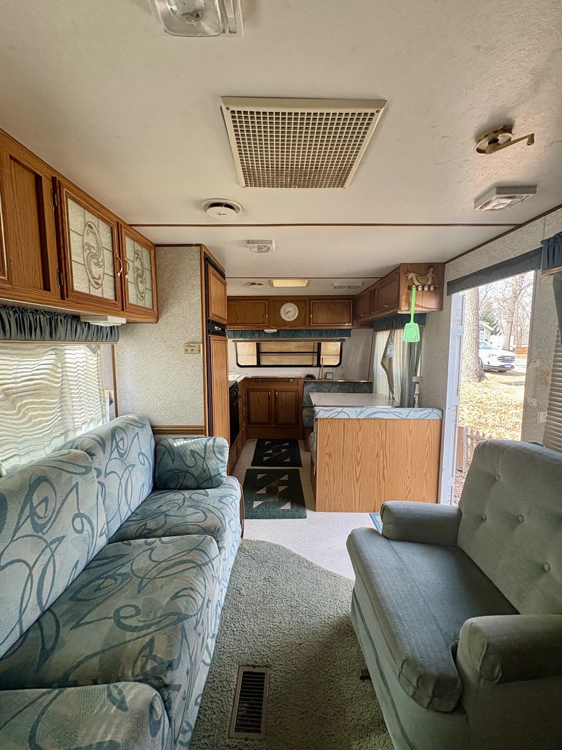 5-498 Woodhaven Sublette, IL 61367 - Photo 8 of 22 a living room with furniture a couch and a fireplace