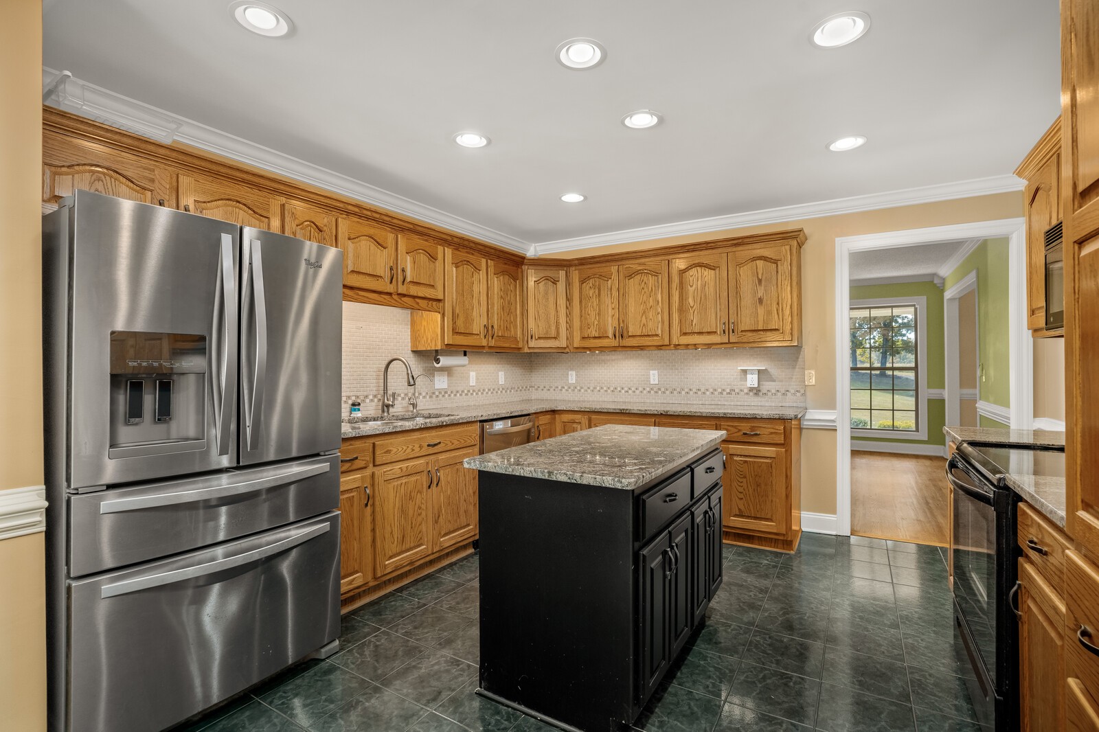 434 Alexander Road Estill Springs, TN 37330 - Photo 12 of 64 a kitchen with stainless steel appliances granite countertop a refrigerator a sink and a stove