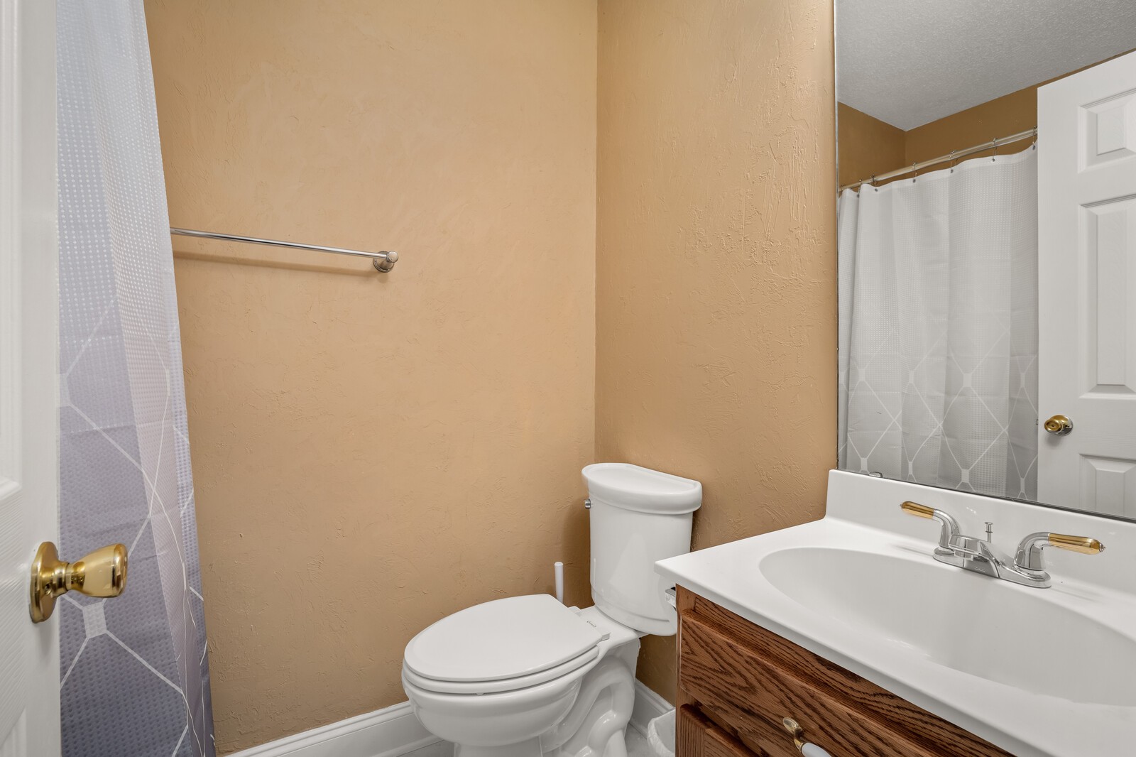 434 Alexander Road Estill Springs, TN 37330 - Photo 26 of 64 a white toilet sitting next to a bathroom sink