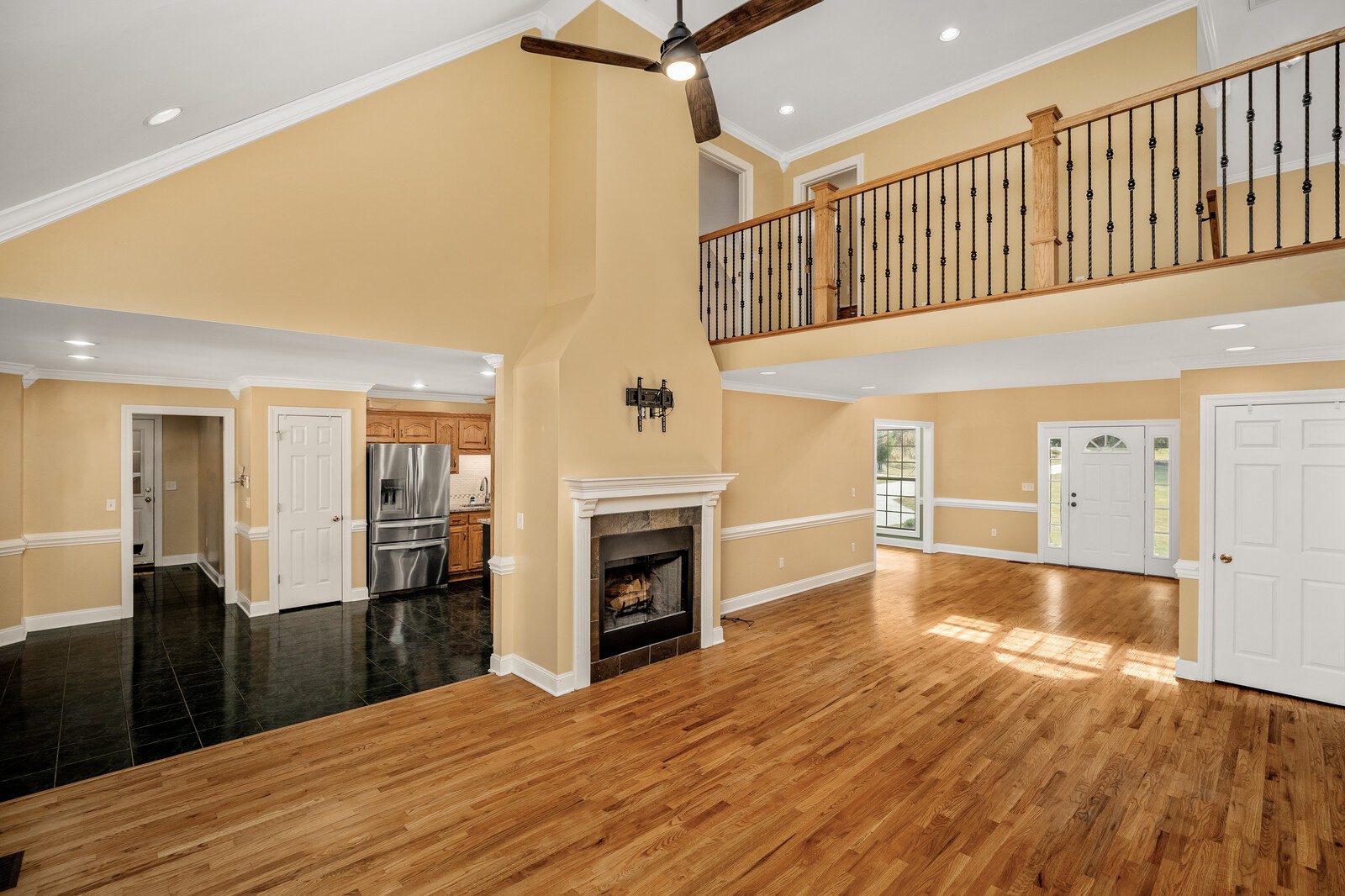 434 Alexander Road Estill Springs, TN 37330 - Photo 10 of 64 a view of a kitchen with a sink wooden floor and a living room