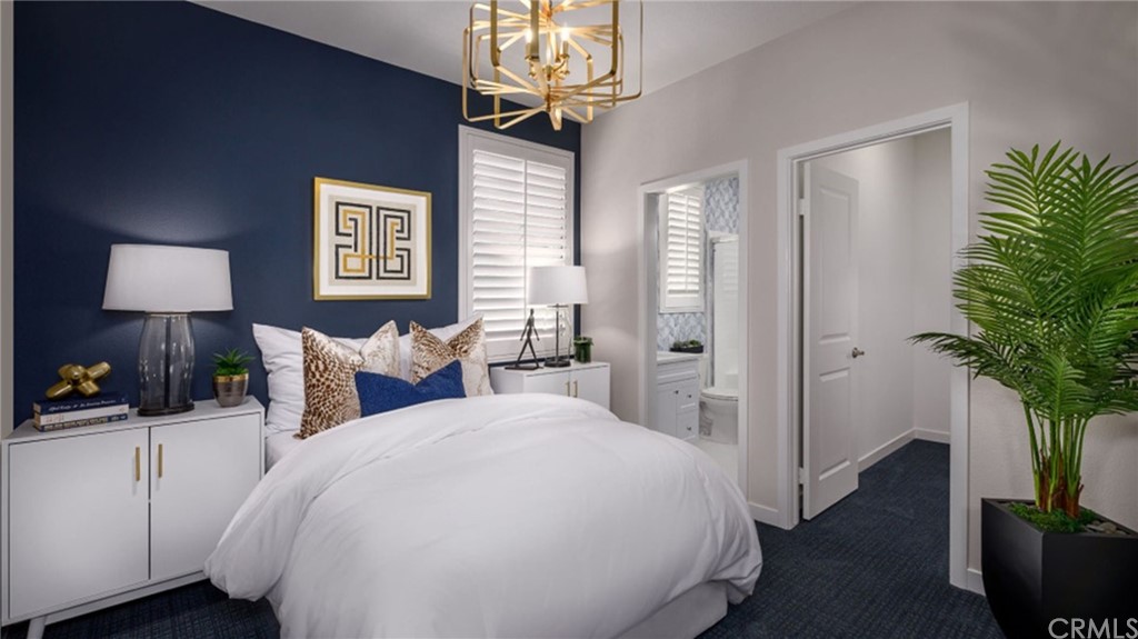 82066 Verdi Road Indio, CA 92203 - Photo 11 of 18 a bedroom with bed and a potted plant