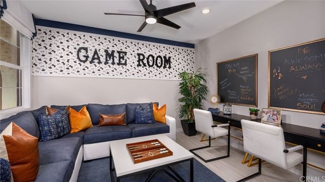 a living room with furniture and a rug