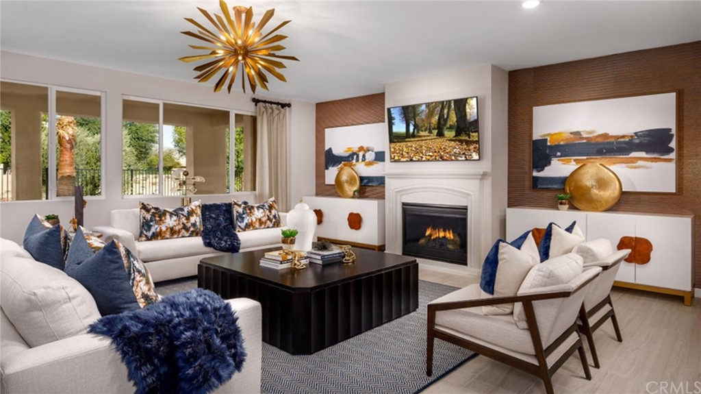 82066 Verdi Road Indio, CA 92203 - Photo 3 of 18 a living room with furniture flower pot and a fireplace