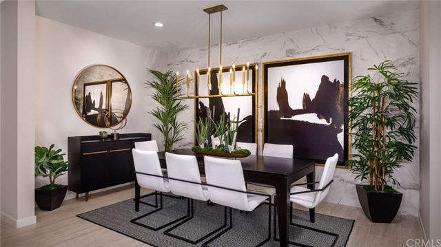 a dining room with furniture and wooden floor