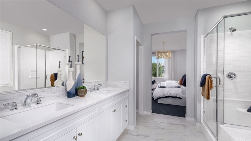 82066 Verdi Road Indio, CA 92203 - Photo 7 of 18 a bathroom with a double vanity sink mirror and shower