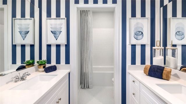 a bathroom with a sink a vanity and a mirror