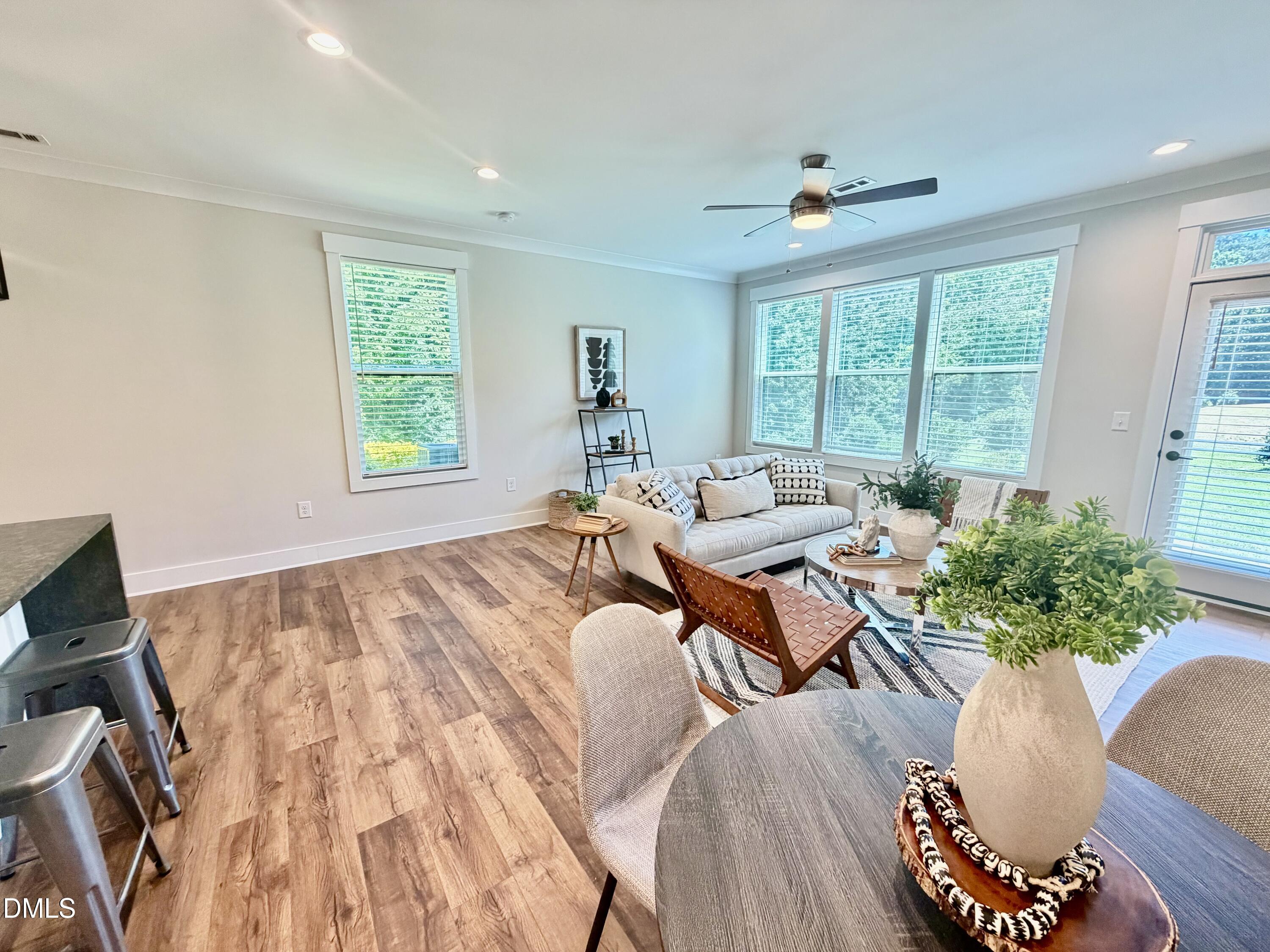 4016 Emerald Green Road Raleigh, NC 27612 - Photo 7 of 22 a living room with furniture and a large window