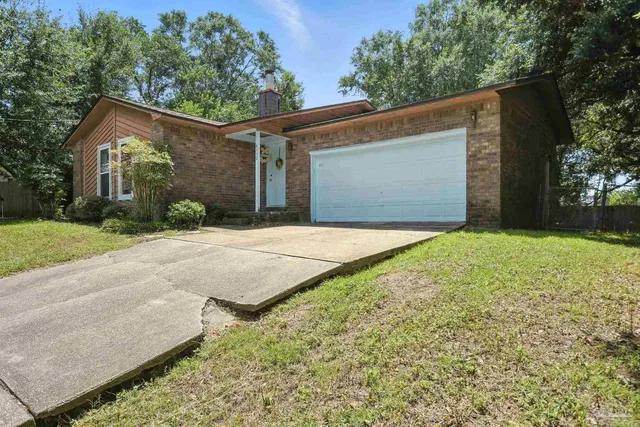 a view of a livingroom with furniture and window
