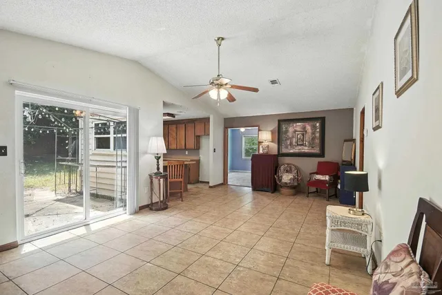 a living room with a fireplace and a table