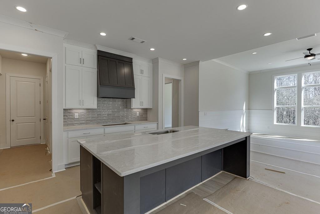 5470 Settingdown Road Cumming, GA 30028 - Photo 15 of 46 a kitchen with a stove and a sink