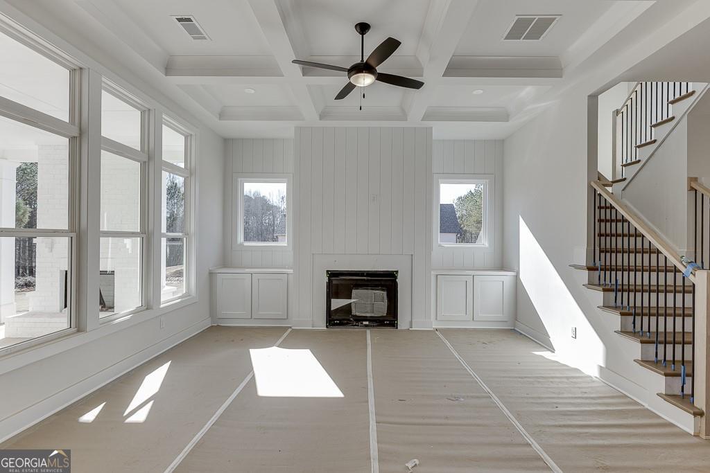 5470 Settingdown Road Cumming, GA 30028 - Photo 22 of 46 a living room with furniture and a fireplace