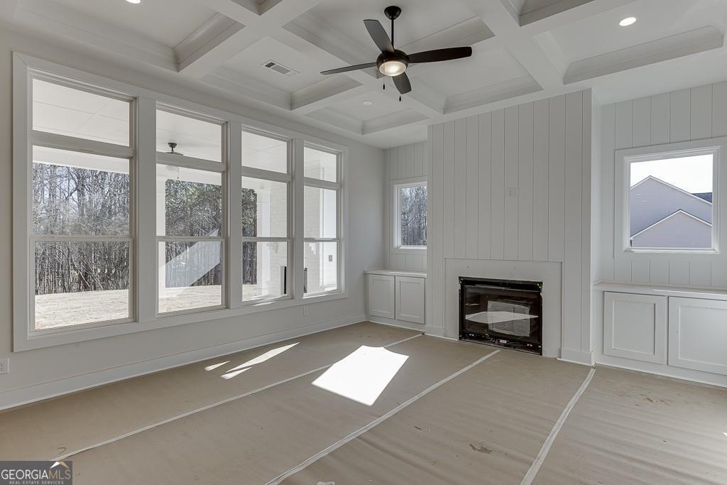 5470 Settingdown Road Cumming, GA 30028 - Photo 23 of 46 a view of livingroom with a fireplace and windows