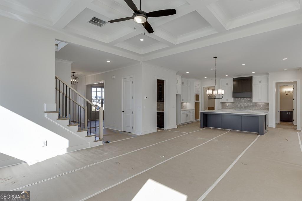 5470 Settingdown Road Cumming, GA 30028 - Photo 24 of 46 a view of an empty room with kitchen and windows