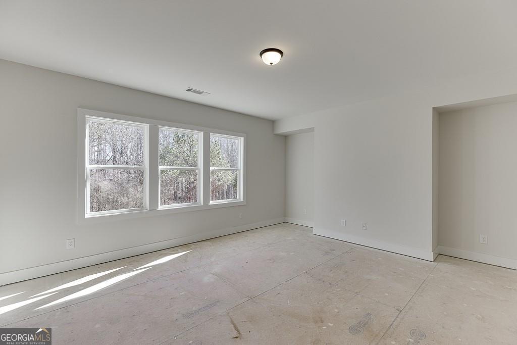 5470 Settingdown Road Cumming, GA 30028 - Photo 29 of 46 an empty room with a window