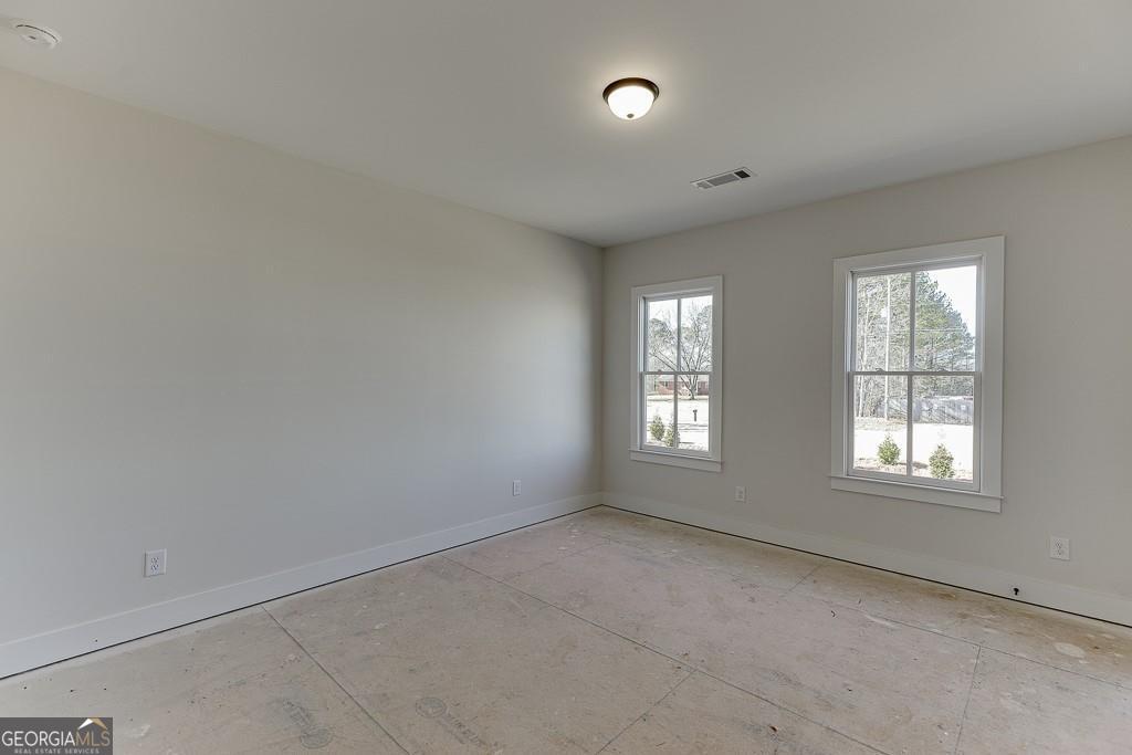 5470 Settingdown Road Cumming, GA 30028 - Photo 30 of 46 an empty room with a window