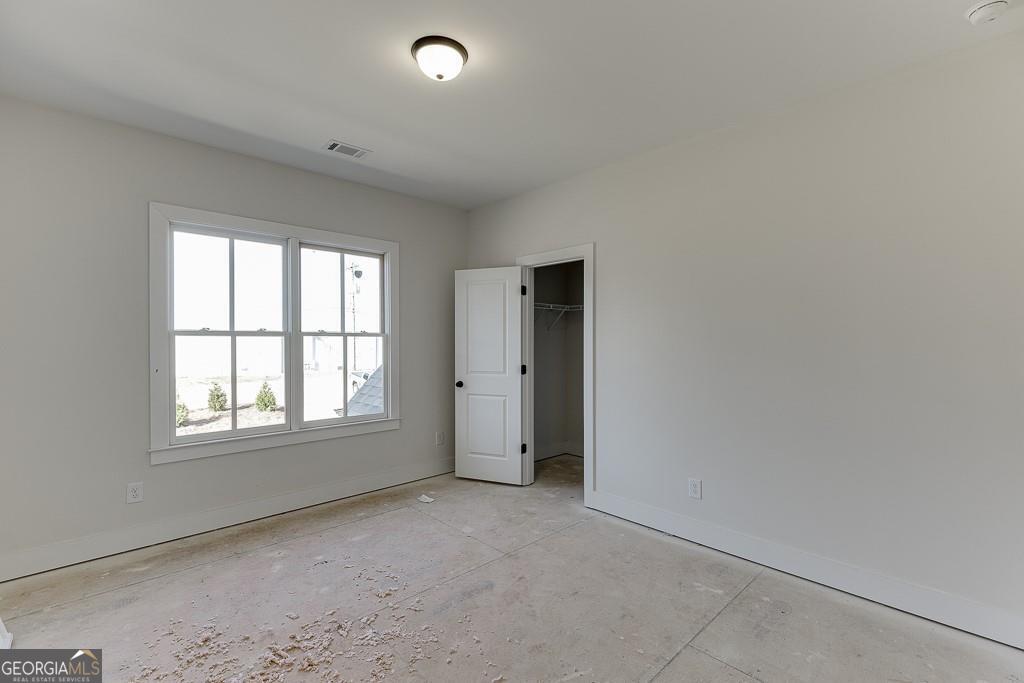 5470 Settingdown Road Cumming, GA 30028 - Photo 33 of 46 an empty room with windows