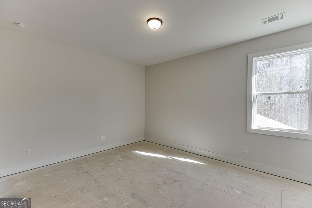 5470 Settingdown Road Cumming, GA 30028 - Photo 34 of 46 an empty room with a window