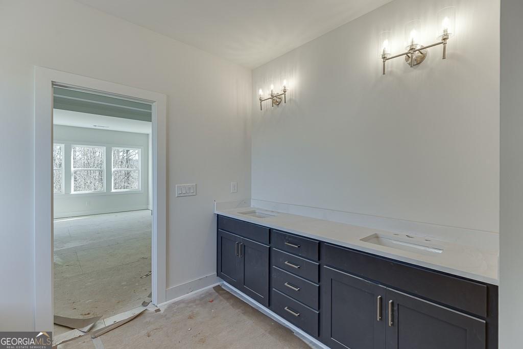 5470 Settingdown Road Cumming, GA 30028 - Photo 42 of 46 a view of cabinets and wooden floor