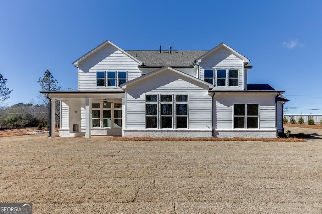 5470 Settingdown Road Cumming, GA 30028 - Photo 44 of 46 a front view of a house with a yard