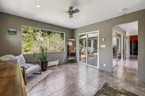 a room with furniture and large windows