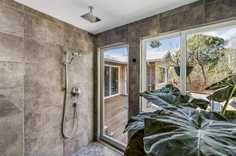 a utility room with dryer washer and a window