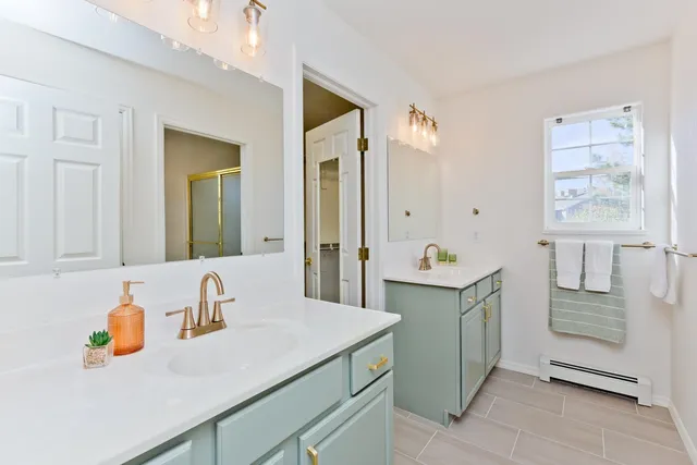 a view of a kitchen area with furniture and wooden floor
