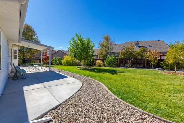a view of a swimming pool with a yard