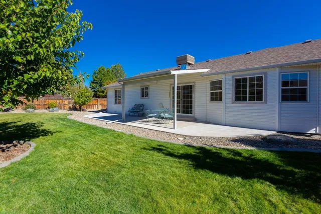 a view of a backyard with a garden and plants